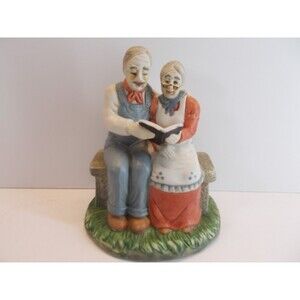ELDERLY COUPLE  PORCELAIN FIGURINE READING TOGETHER/ FAST SHIPPING